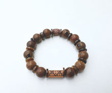 Load image into Gallery viewer, Wooden bead bracelet with thin shiny brown shells.