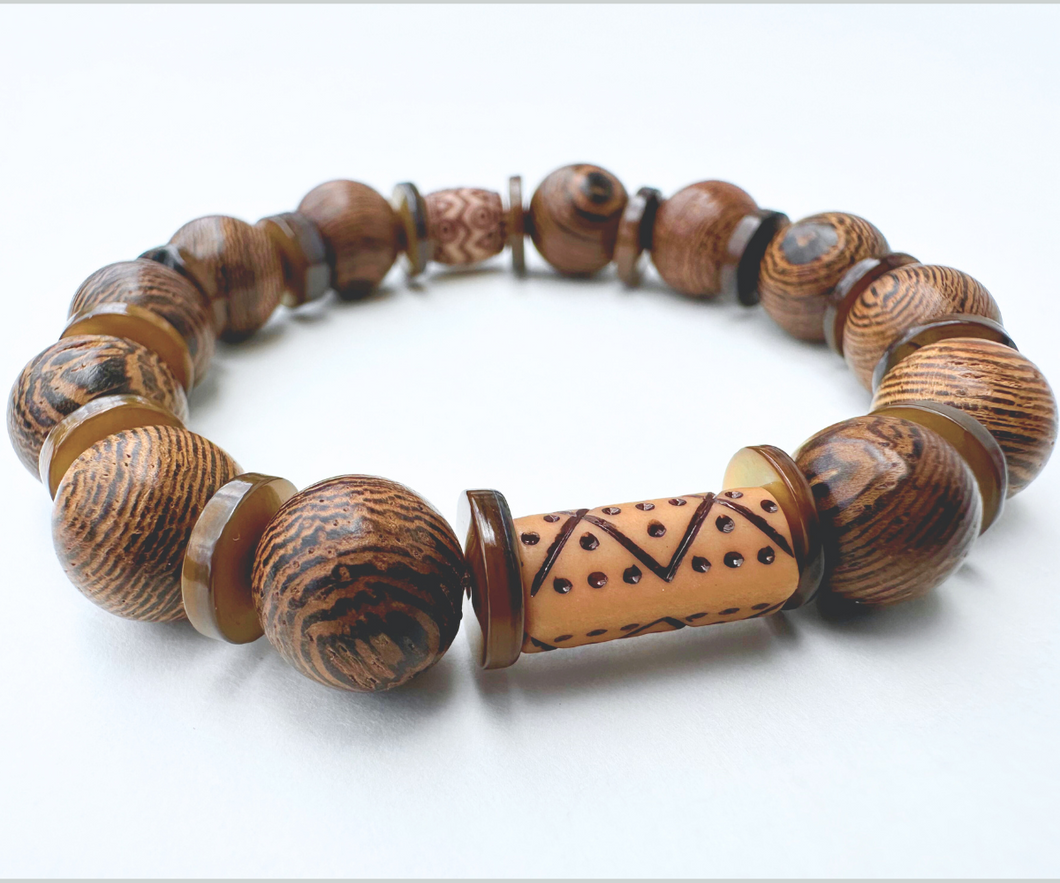 Wooden bead bracelet with thin shiny brown shells.