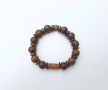 Load image into Gallery viewer, Wooden bead bracelet with thin shiny brown shells.
